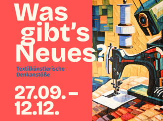 Ein Quilt und die Ankündigung zur Sonderausstelung "Was gibts Neues?"